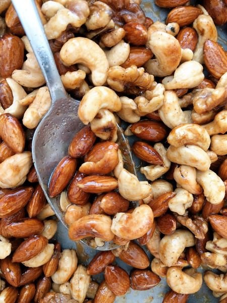 Coating the Nuts in Sweet Spice Mixture - Sweet Salty Spicy Nuts Recipe