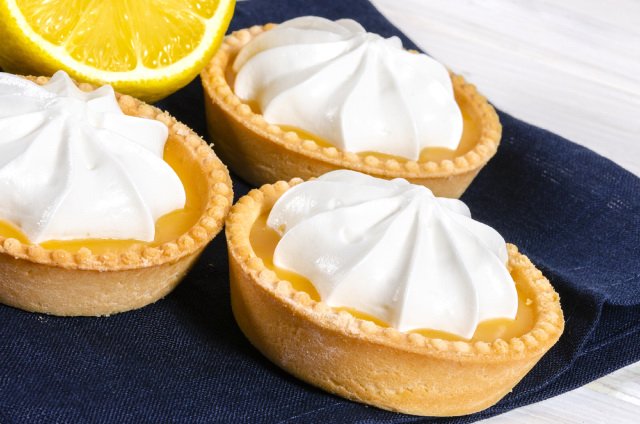 Lemon tarts topped with whipped cream